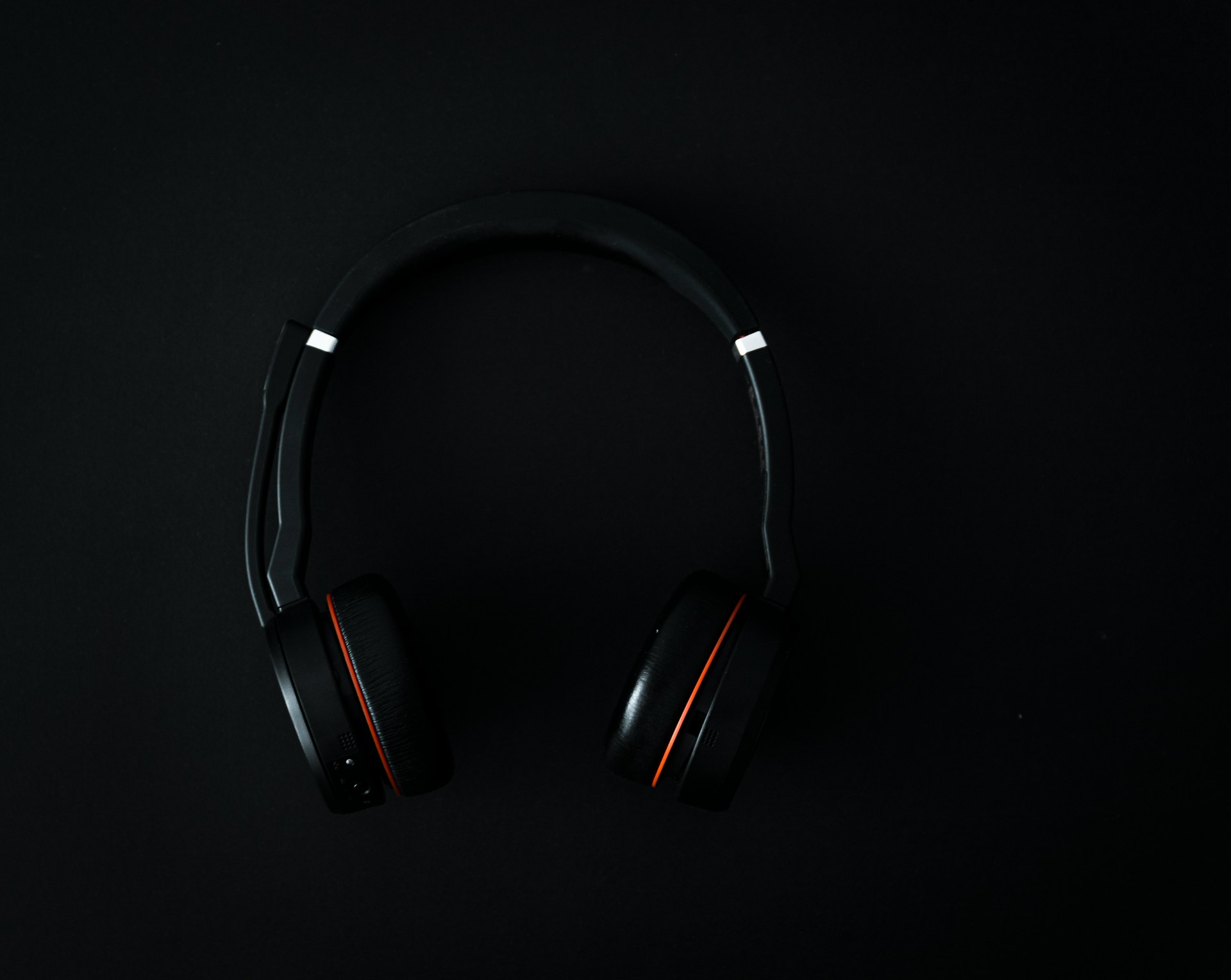 Black headphones on a black background